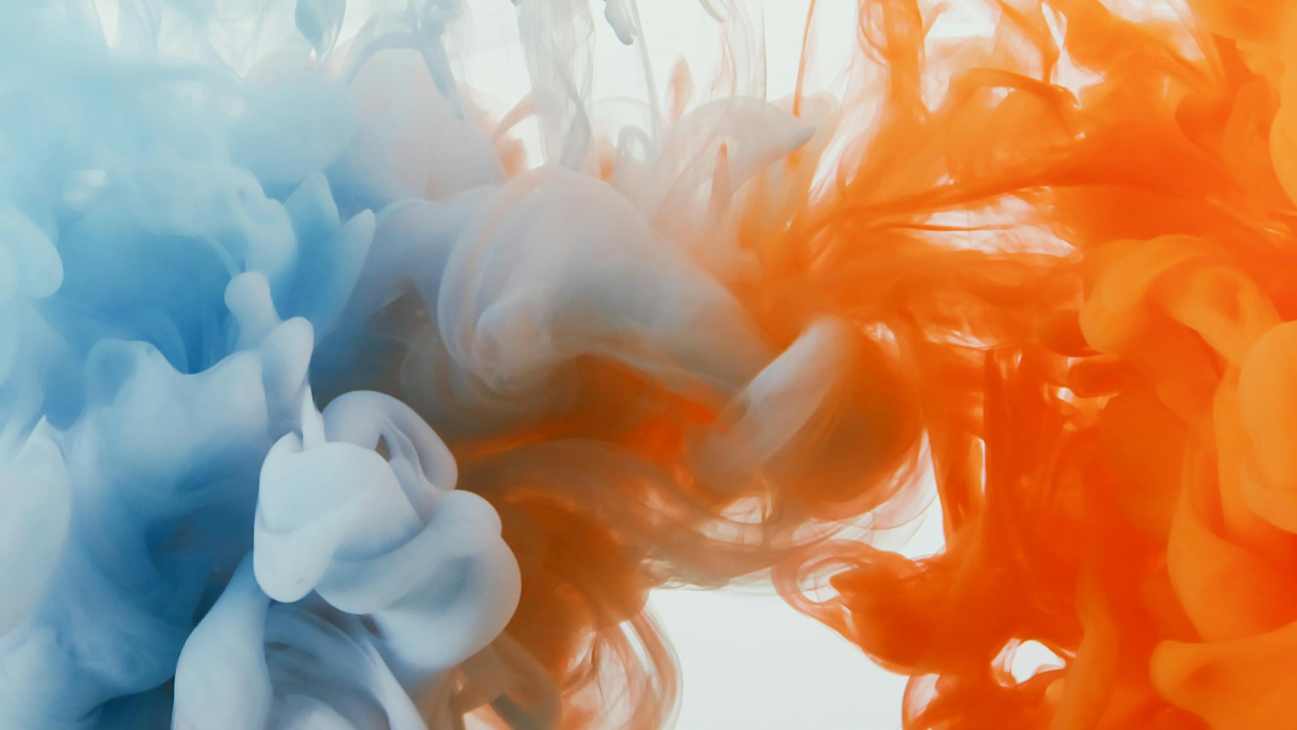 Abstract flow of blue and orange colors creating a dynamic and vibrant scene.
